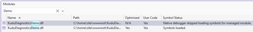 Modules window showing two entries for KuduDiagnosticsDemo.dll, with one instance successfully loading symbols and the other marked as skipped by the native debugger for managed symbol loading.