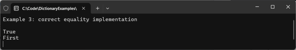 Console output from a C# Dictionary example showing successful equality implementation with a true comparison result and retrieved value "First".