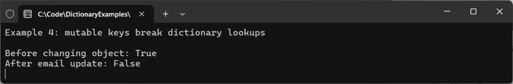 Console output from a C# Dictionary example demonstrating how mutable keys break dictionary lookups after an object property change.